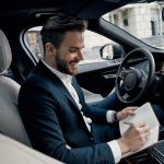then-i-am-going-meet-with-handsome-young-man-full-suit-writing-something-down-personal-organizer-smiling-while-sitting-inside-car_425904-12615-768x512